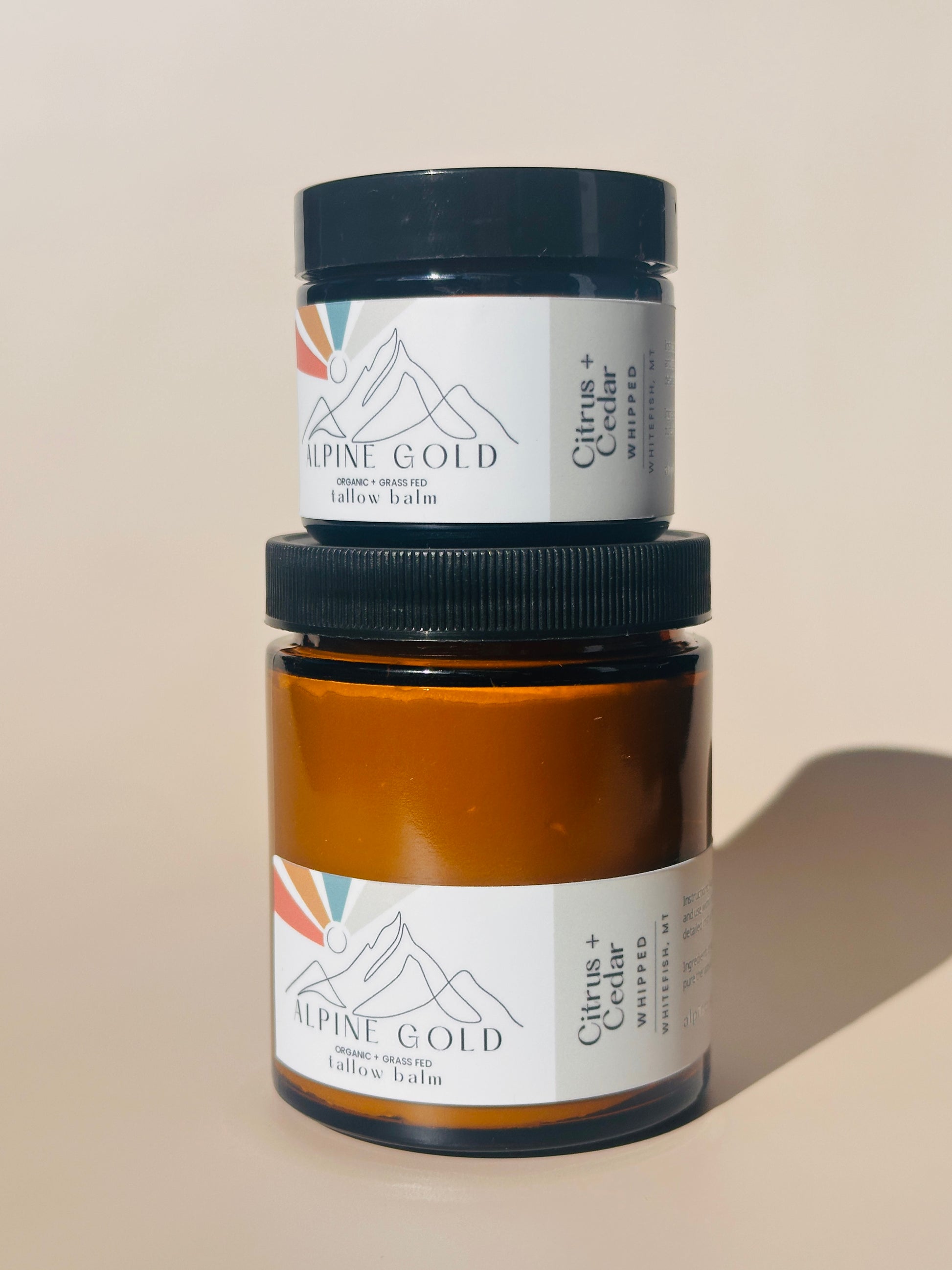 Two jars labeled 'Alpine Gold' on a plain background