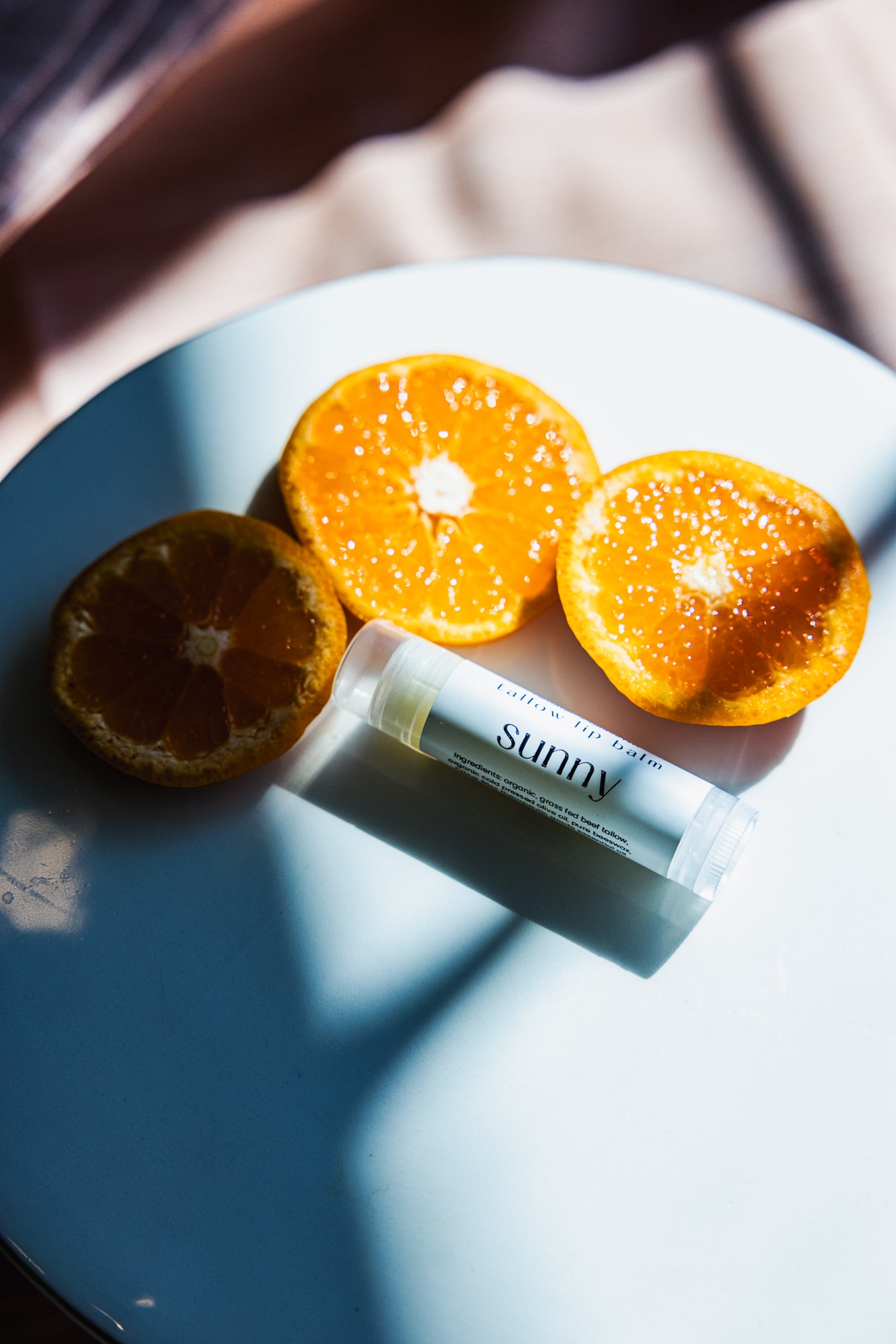 Alpine Gold Tallow Based lip balm in SUNNY. A light citrus blend to brighten any day. All natural, non-toxic, chemical free - made from certified organic and grass fed tallow. Hydrating, vitamin packed, anti-aging.